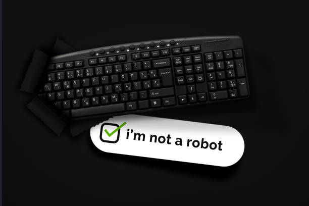 PC keyboard with i'm not a robot box on black background.