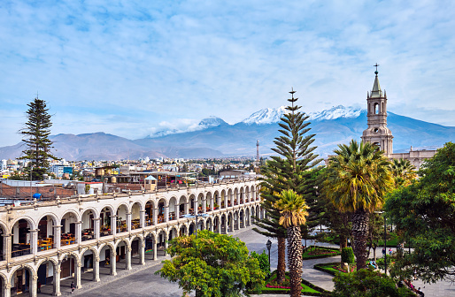 Main square of the city with ancient architecture and views of the Andes. Arequipa, Peru.