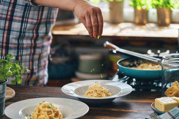 istock Preparing Fettuccine Pasta Alfredo with Parmesan 1404262513