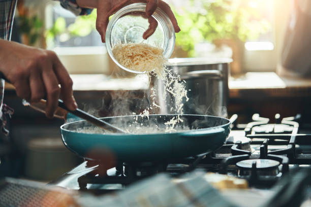 istock Preparing Fettuccine Pasta Alfredo with Parmesan 1404262574