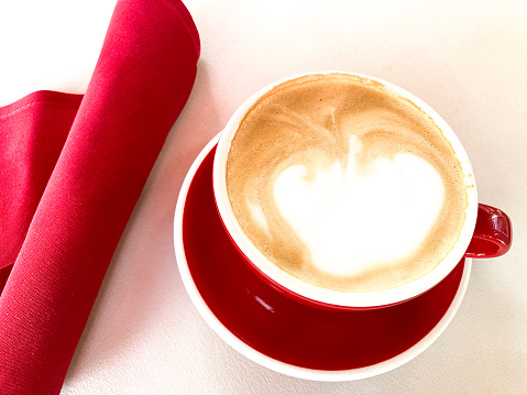 Pretty Cappuccino in Red Cup, Red Napkin (Close-Up)