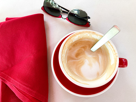 Pretty Cappuccino in Red Cup, Red Napkin, Red Sunglasses (Close-Up)
