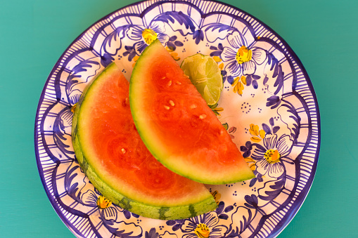 Two Watermelon Slices on Blue Floral Plate