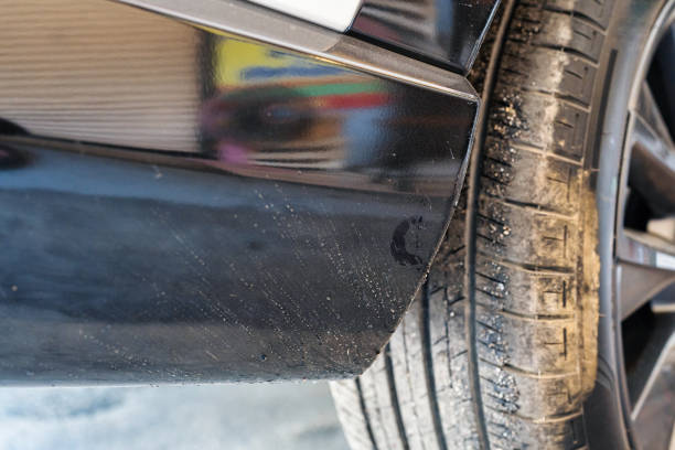 istock Tarmac and mud stains on black plastic bumper car 1404266978