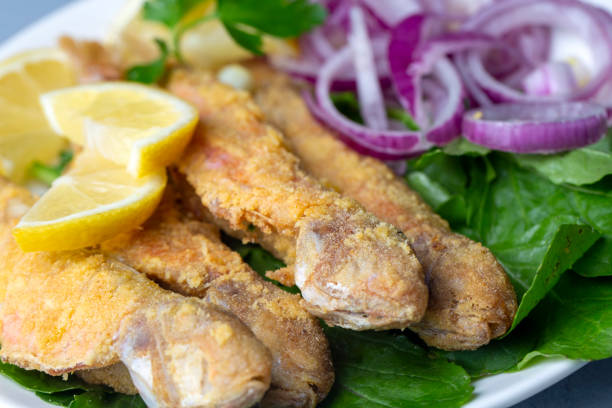 istock Plate of fried small fish red mullet and lemon 1404267699