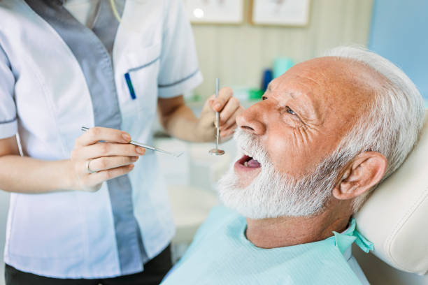 istock Female dentist with patient 1404268060