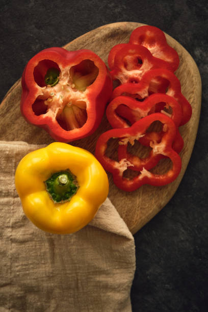 istock yellow and red peppers on the cutting board 1404271306