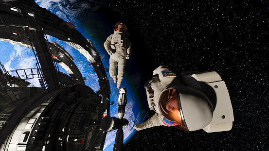 An CG astronaut in a modern space suit, connected to a tethered lifeline floats in deep space and looks at the lights of planet earth as the sun rises. Distant stars and galaxies are visible in the background. Credit: NASA https://earthobservatory.nasa.gov/images/79790/city-lights-of-asia-and-australiaand ESO for background images.