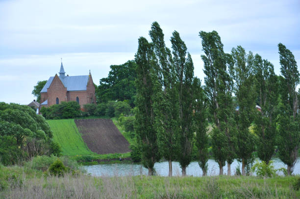 istock Rural landscape with a church 1404272747