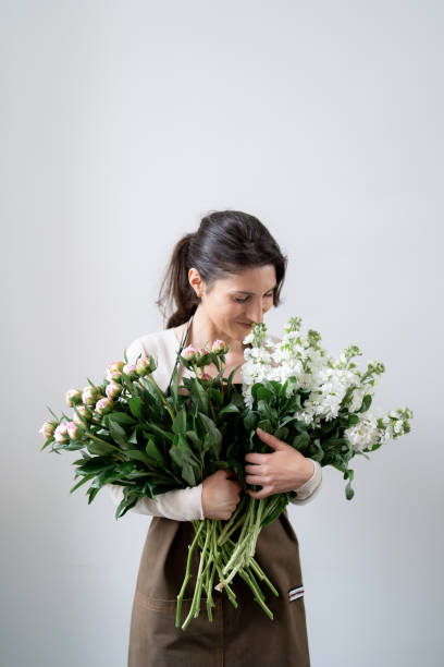 Free Stock Photo of Woman Holding Bunch of White Flowers | Download ...