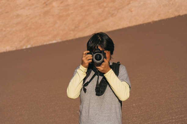 istock Photographer in the desert 1404283158