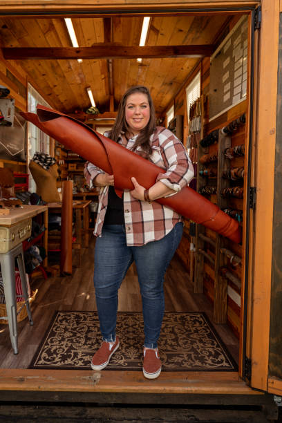 istock Portrait of leather craftswoman standing in workshop 1404283623