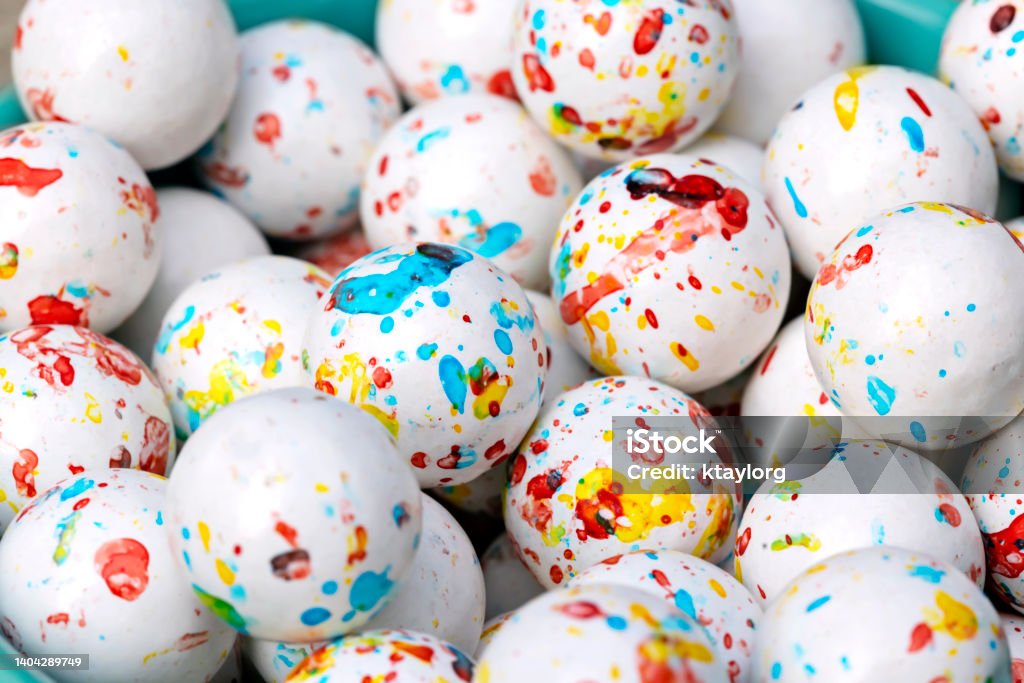Closeup of multi-colored jawbreaker candy Balls of jawbreaker gum appear paint-splattered Candy Store Stock Photo