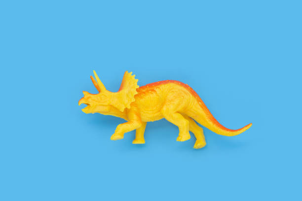 istock Plastic triceratops, Dinosaur toy on blue background. 1404291077