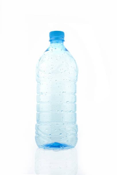 istock Empty wet transparent bottle isolated on white background. Blue plastic water packaging 1404291223