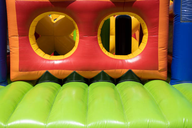 istock Inflated obstacle course. Rubber trampoline. Entertainment area in summer. 1404292105