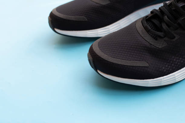 istock Sneakers shoes on blue background. 1404292177