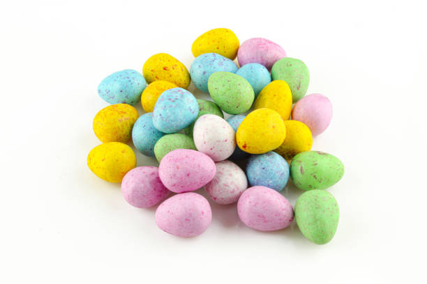istock Colorful egg shaped chocolate candies isolated on white background 1404292382