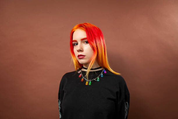 Studio portrait of an 18 year old woman with dyed hair stock photo