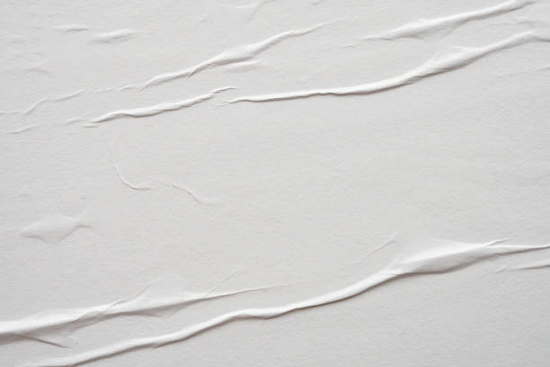 istock white crumpled and creased paper poster texture background 1404300653