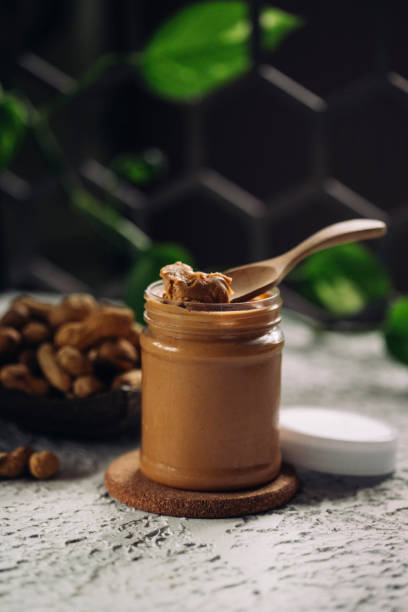istock peanut paste and peanuts, the concept of healthy food 1404301322