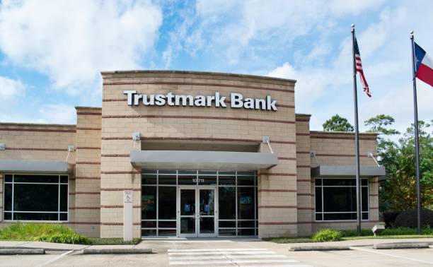 Trustmark Bank exterior and main entrance in Houston, TX. Houston, Texas USA 12-05-2021: Trustmark Bank exterior and main entrance in Houston, TX. Commercial financial institution originally founded in 1889. bank entrance stock pictures, royalty-free photos & images