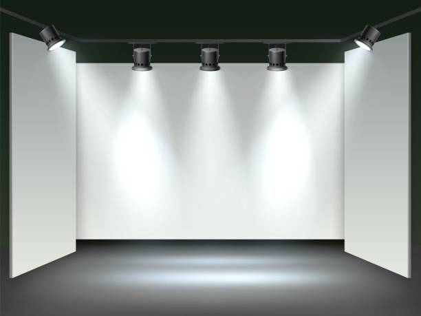 istock Floodlights gallery hall. Realistic museum exhibition, blank mockup, white walls, studio spotlights, front view interior, empty performance or presentation product scene, vector background 1404305574