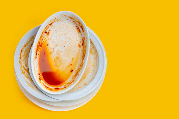 istock Dirty dishes on yellow background. Top view 1404307141
