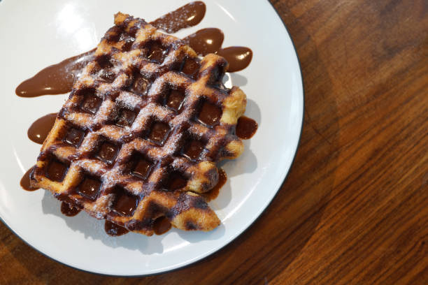 istock Belgian waffle with chocolate spread and sugar 1404308522
