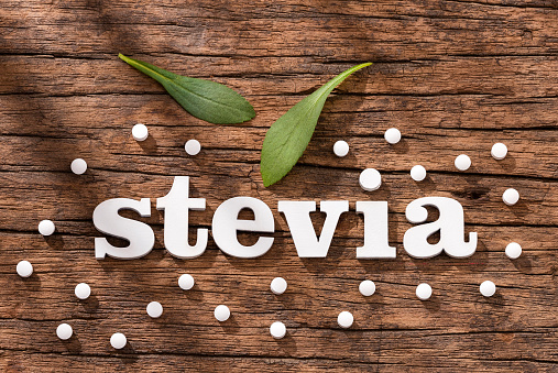 Stevia rebaudiana - Leaves and tablets of the stevia plant
