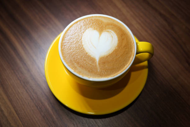 istock A cup of coffee latte on wooden background 1404310362