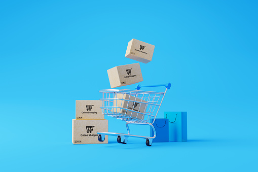 Online shopping concept. Web or mobile application e-commerce. Carton paper box with shopping cart and shopping bag on blue background. 3d rendering