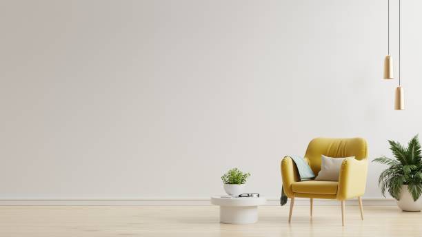 istock Interior has a yellow armchair on empty white color wall background. 1404315982