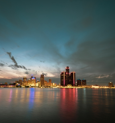 Cityscape of Detroit skyline in Michigan, USA at sunset shot from Windsor, Ontario Canada