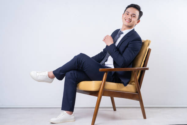 istock Image of young Asian businessman on background 1404319594