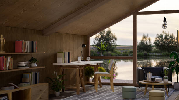 istock Modern Scandinavian wooden cottage interior design with triangle large window with lake view. 1404320698