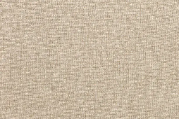 Photo of Brown linen fabric texture background, seamless pattern of natural textile.