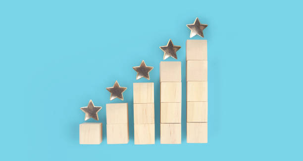 istock Wooden blocks with the five star symbol Increase rating 1404323721
