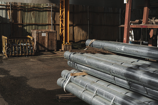 Ductile cast iron pipes stored at an open warehouse