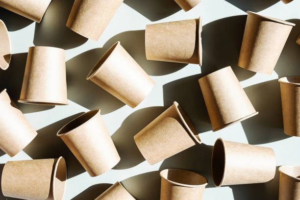 istock Some disposable paper coffee cup. Mock up to go coffee cups with shadow, top view. 1404328113