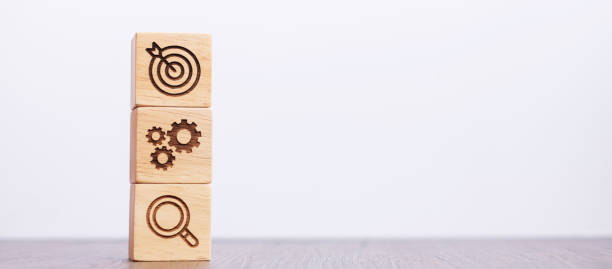 istock wood block with business goal, strategy, target, mission, action, objective, teamwork, brainstorm and idea concept 1404329133