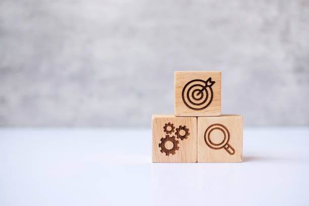 istock wood block with business goal, strategy, target, mission, action, objective, teamwork, brainstorm and idea concept 1404329186