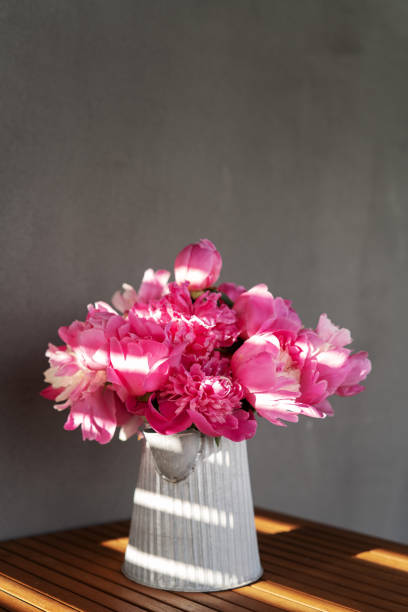 istock Closeup peony bouquet in vase 1404330339
