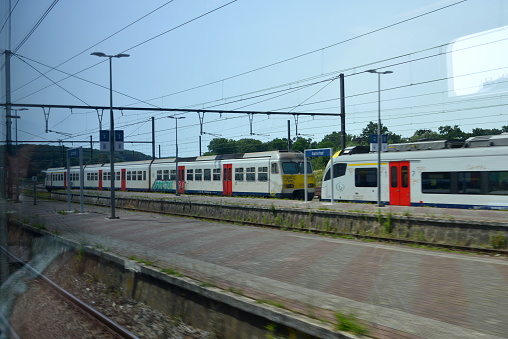Aarschot, Vlaams-Brabant, Belgium - June 18, 2022: stationary modern design locomotive of the national railways NMBS, SNCB waiting on platform of station city Aarschot