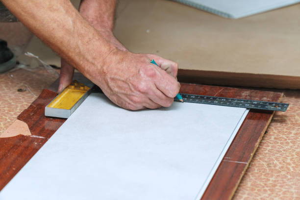 istock The worker marks the plastic panel with a pencil and tape measure or ruler 1404332385