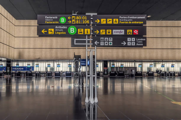 Barcelona, Spain - November 24, 2021: Information board inside Josep Tarradellas Barcelona-El Prat Airport. Modern way signpost with icons on the background of ticket offices