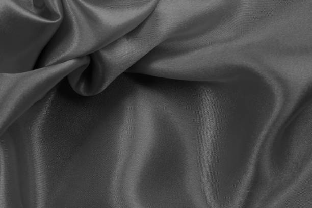 istock Dark grey fabric texture background, detail of silk or linen pattern. 1404333471