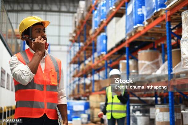Warehouse Or Supply Chain Engineer Work With Worker To Check Inventory At Site Line Of High Rack Warehouse Stock Photo - Download Image Now