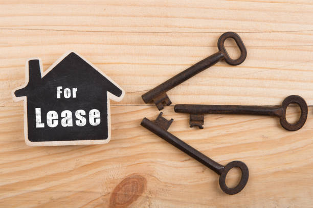 istock real estate Lease concept - little house model 1404336284