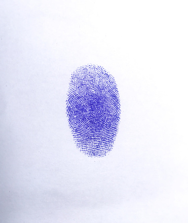 Blue thumb impression on white paper